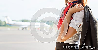 Stewardess on the airfield. Stock Photo