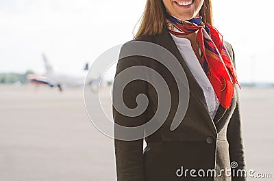 Stewardess on the airfield. Stock Photo