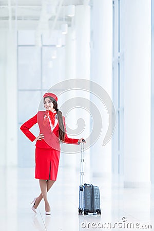 Stewardess with luggage Stock Photo