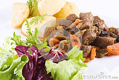 Stewed beef steak with potatoes and salad Stock Photo
