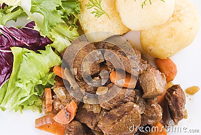 Stewed beef steak with potatoes and salad Stock Photo