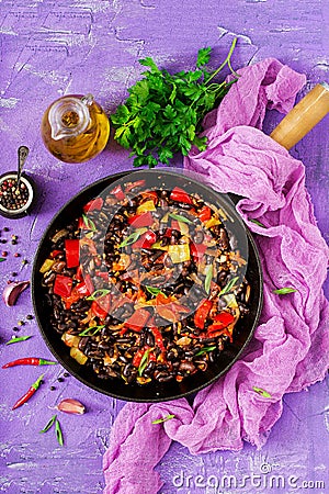 Stewed black beans with sweet peppers and tomatoes with spicy sauce Stock Photo