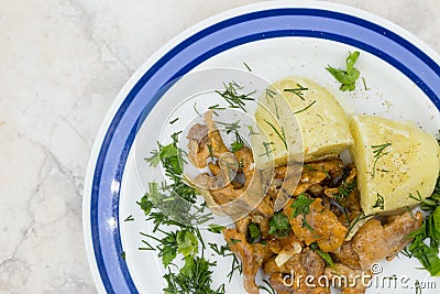 Stewed chanterelles in white sauce with boiled potatoes Stock Photo