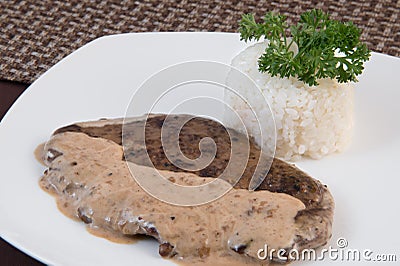 Stewed liver in sour cream Stock Photo