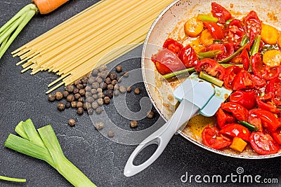 Stewed tomatoes in frying pan Stock Photo