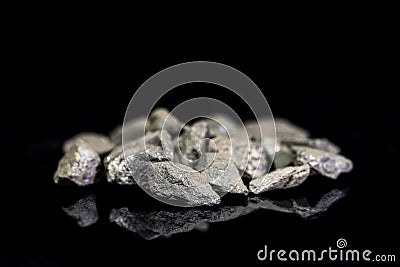 Stibnite or antimonite ore, raw rocks on black background, mining and geology Stock Photo