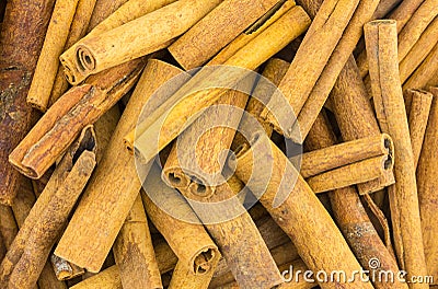 Stick cinnamon pile of dry fragrant spices background culinary base Stock Photo