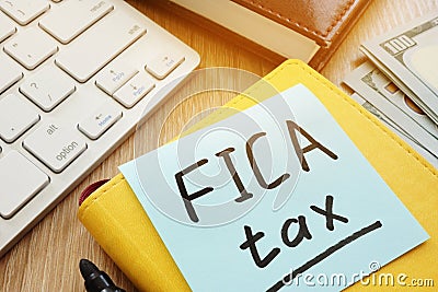 Stick with words fica tax and keyboard. Stock Photo