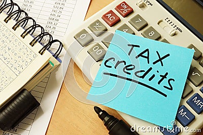 Stick with words tax credits. Stock Photo