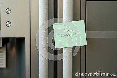 Sticker on the fridge with the words don`t touch me Stock Photo