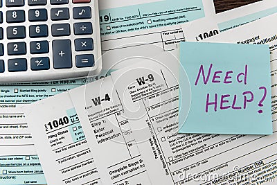 Sticker with text Need Help and 1040 tax form, pen and calculator. Deadline Editorial Stock Photo