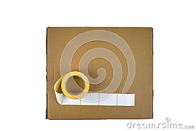 Stickers on a cardboard box, isolate on a white background. Sticky white labels. Roll of white stickers. The concept of delivering Stock Photo