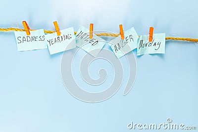 Stickers with inscriptions in Blue Monday on a rope with clothespins Stock Photo