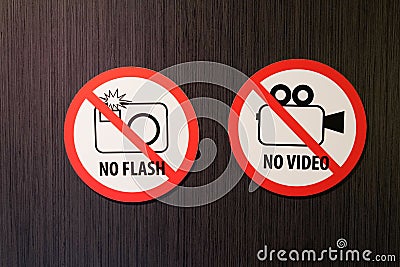 Stickers no photographing flash prohibition and no video signs Photo video camera sign in crossed circle in entrance facade Stock Photo