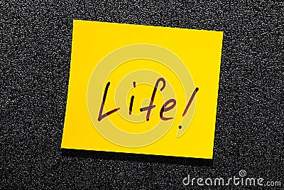 Sticky leaf on the wall. inscription marker word life Stock Photo