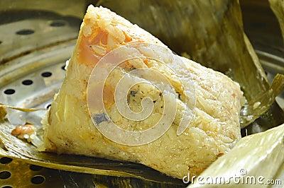 Sticky rice steam with pork and salt egg wrapped in banana leaf of Chinese Duanwu festival on pot Stock Photo