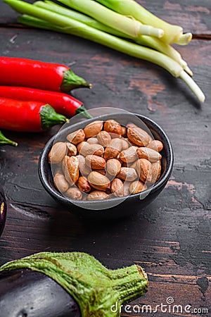 Sticky teriyaki aubergine ingredients, peanut close up side view Stock Photo