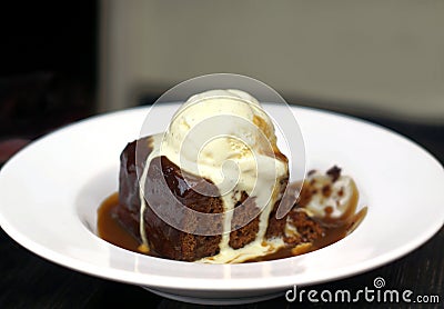 Sticky Toffee Pudding with Ice Cream Stock Photo