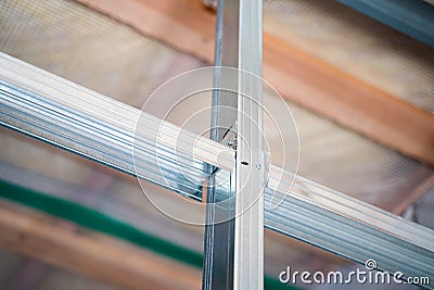 Stiffening ribs in a metal profile frame in a plasterboard wall close-up. Building a wall in a private house Stock Photo