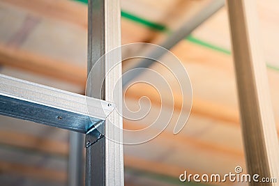 Stiffening ribs in a metal profile frame in a plasterboard wall close-up. Building a wall in a private house Stock Photo