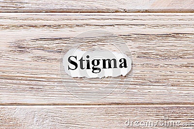 Stigma of the word on paper. concept. Words of Stigma on a wooden background Stock Photo