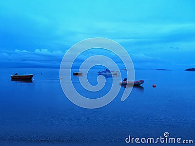 Still boats on the sea at bluehour Editorial Stock Photo