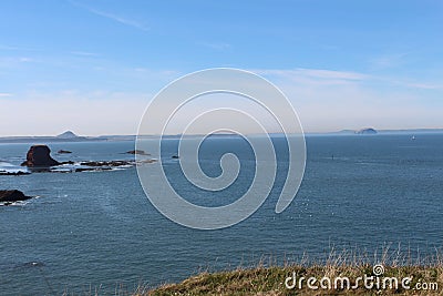 Still and calm seascape scene in sunny Scotland Stock Photo
