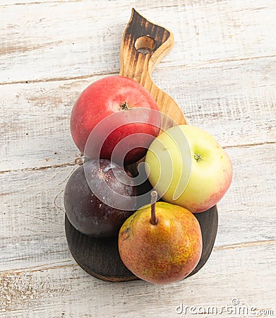 Still life of apples with a plum and pear Stock Photo