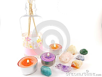 Still life of aromatic candles and precious stones. Stock Photo