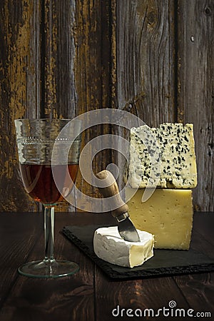 Still life with assorted cheese tacos, blue cheese, brie, manchego Stock Photo