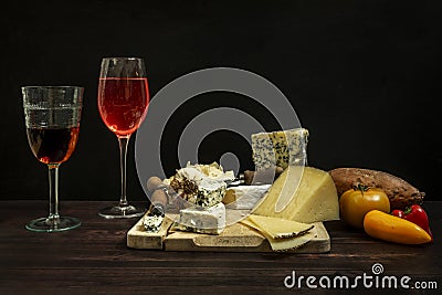 Still life with assorted cheese tacos, blue cheese, brie, Manchego cheese Stock Photo