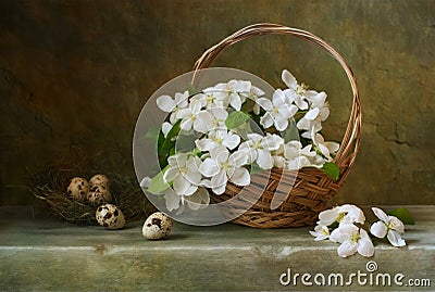 Still life with a basket of flowers apple Stock Photo