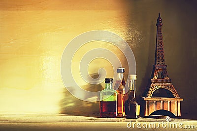 Still life of bottle of alcohol with eiffel model on a shelve, v Stock Photo