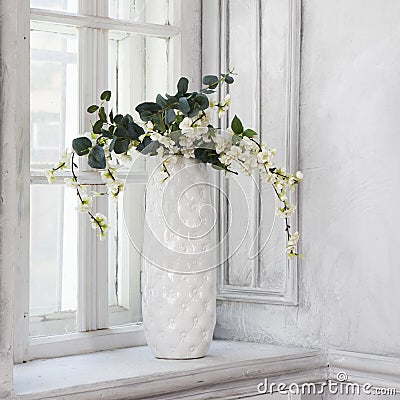 Still life with bouquet of artificial cherry blossoms Stock Photo