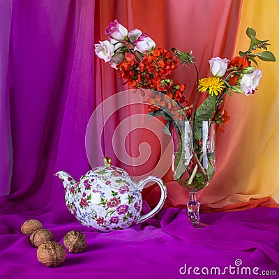 Still life with bouquet summer flowers, teapot and walnuts Stock Photo