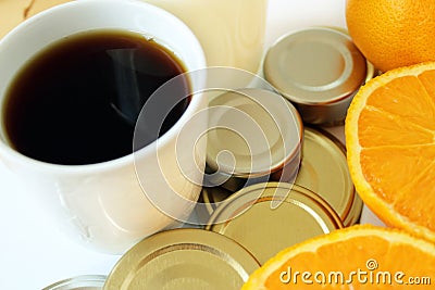 Commodity close up with wood, coffee, milk, metal and oranges Stock Photo