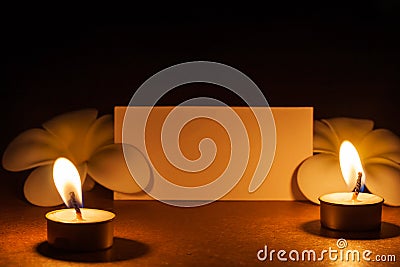 Still life candle with flower and note paper,abstract background for pray or meditation caption Stock Photo