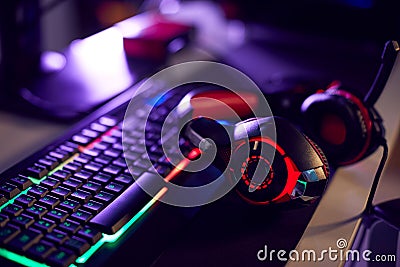 Still Life Of Computer Gaming With Headset Lying On Keyboard Stock Photo