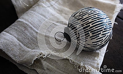 Still life consist of Christmas ball and vintage linen towel. Lifestyle image background Stock Photo