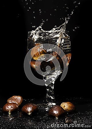 Still Life with Cup, Water, Chestnuts Stock Photo