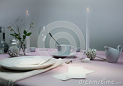 Still life. elegant table setting. tablecloth, candles, antique china - cup, saucer Stock Photo