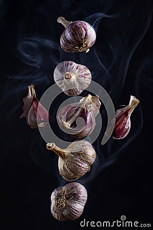 Still life - flying in the smoke garlic Stock Photo