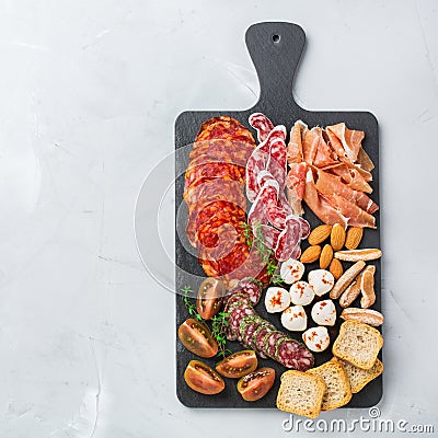 Assortment of spanish tapas or italian antipasti with meat Stock Photo