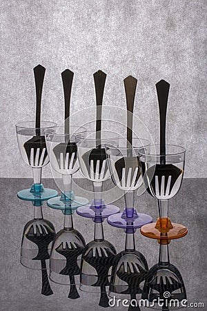 Still life with forks in glasses with clear liquid Stock Photo