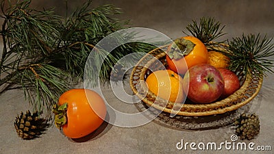 Still life with fruit and pine branch Stock Photo
