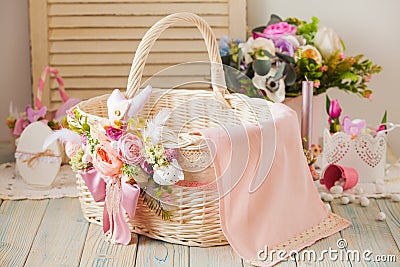 Wicker basket decorated with flowers and laces Stock Photo