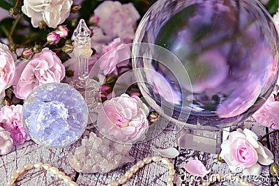 Still life with magic crystal ball, pink roses and necklace Stock Photo