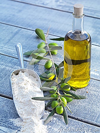 Still life-olive oil, flour and olives Stock Photo