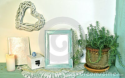 Still life with photo picture frame, succulent plant, heart decoration on wooden shelf Stock Photo