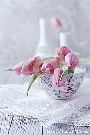 Still Life with Pink Tulips on a Tea Cup Stock Photo